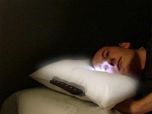 A glowing alarm clock pillow