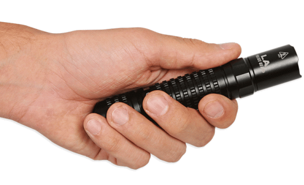 man holding flashlight in hand