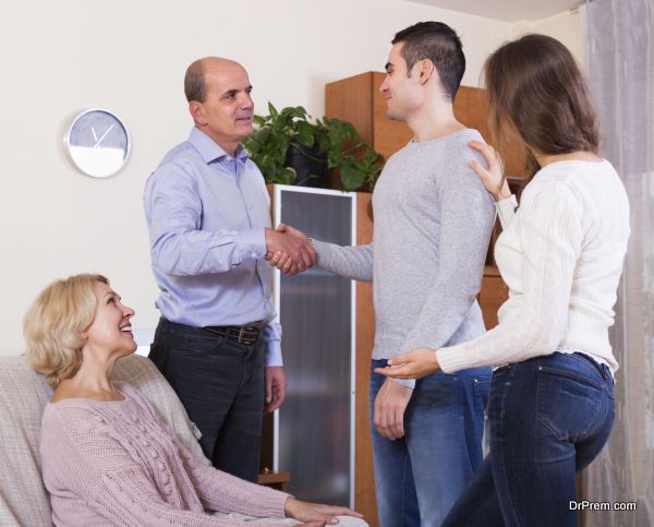 Young girl showing his future husband to happy parents