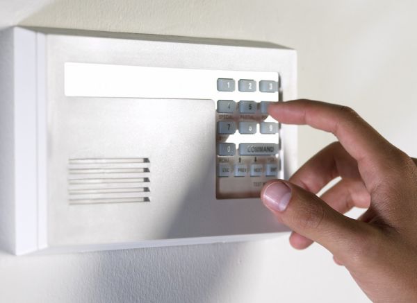 disarming alarm system --- Image by © Royalty-Free/Corbis