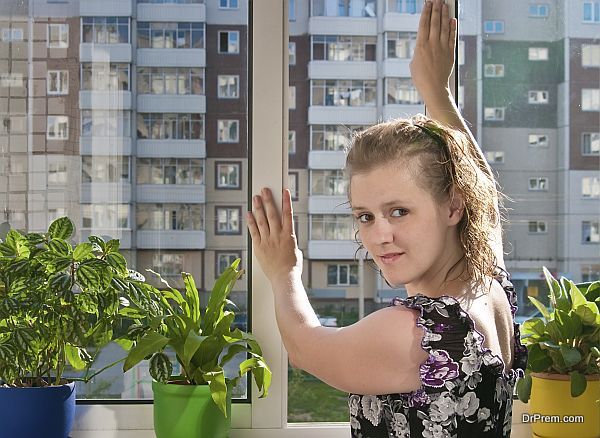 Girl closes a window