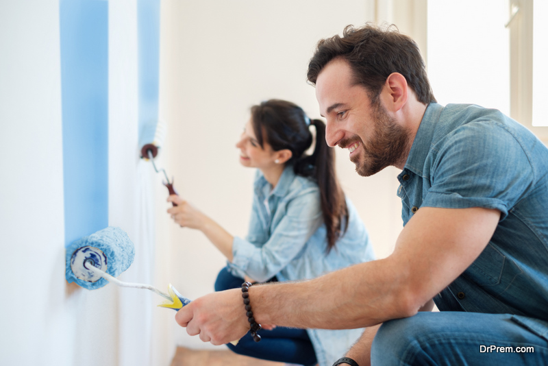 couple-busy-in-doing-a-coat-of-paint