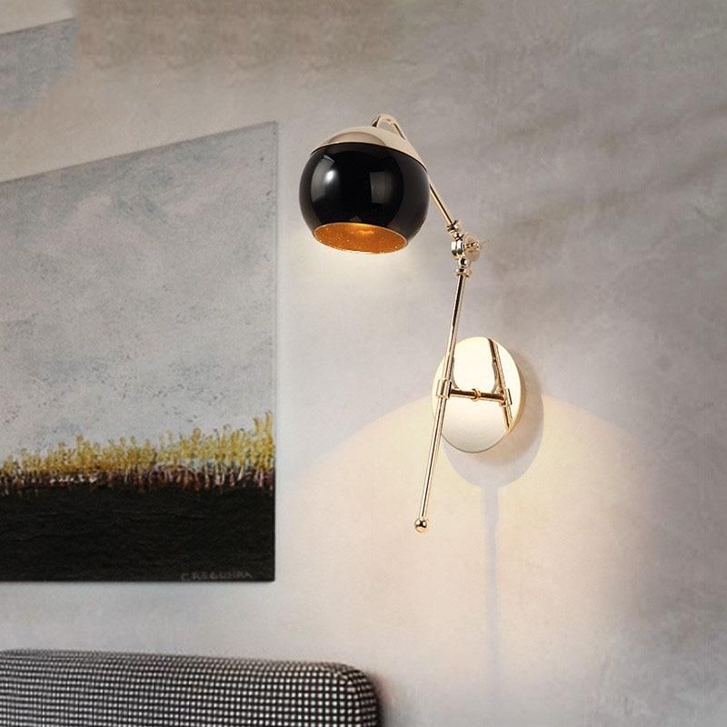 Gold Sconce & Eva's Black Glass Ball