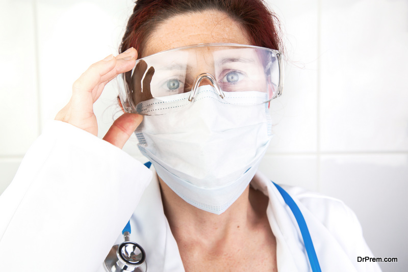 doctor adjusting her protective glasses