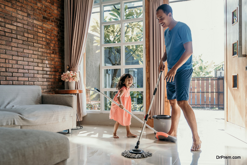 father and daughter cleaning the home