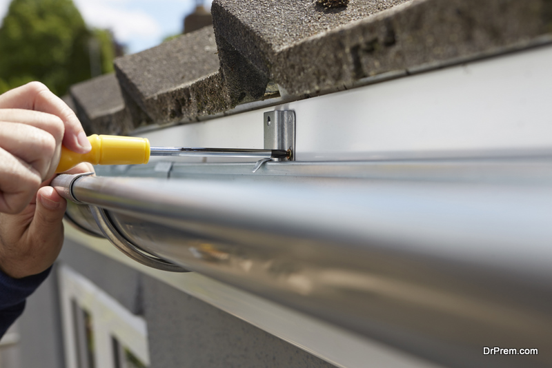 Man Replacing Guttering