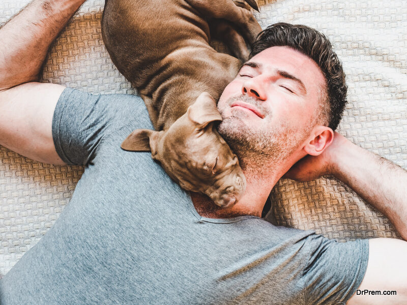 man-sleeping-with-dog