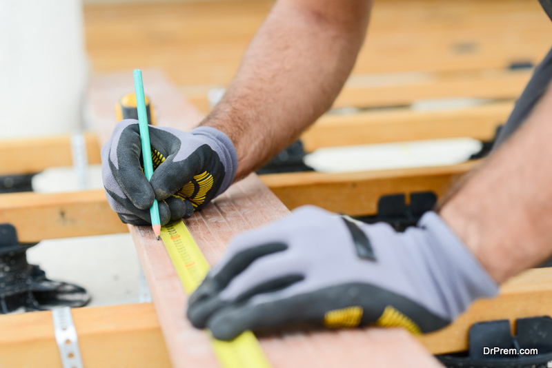 man using gloves during Carpentry 