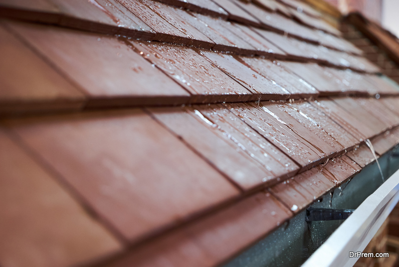 Wet tile roof of the house
