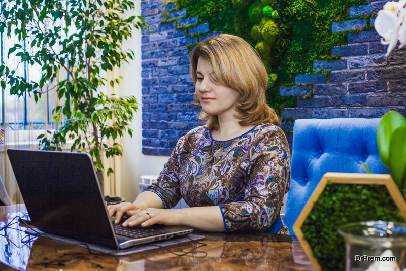 A young woman is working in her office 