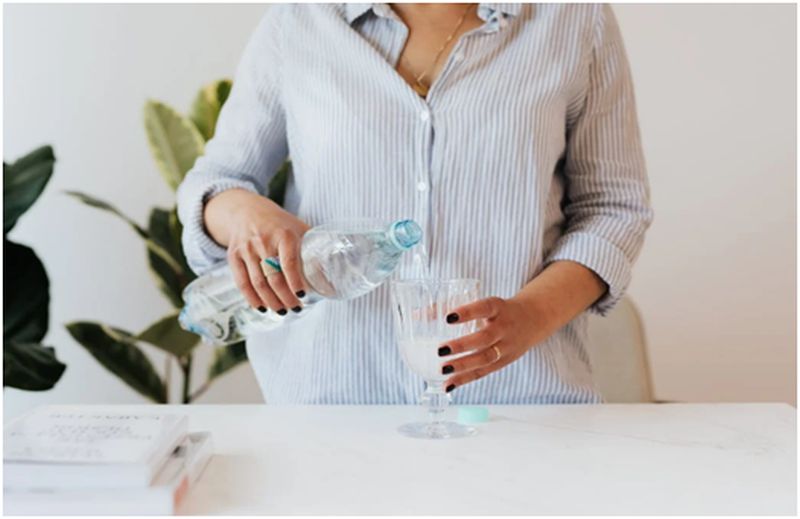 woman pouring water