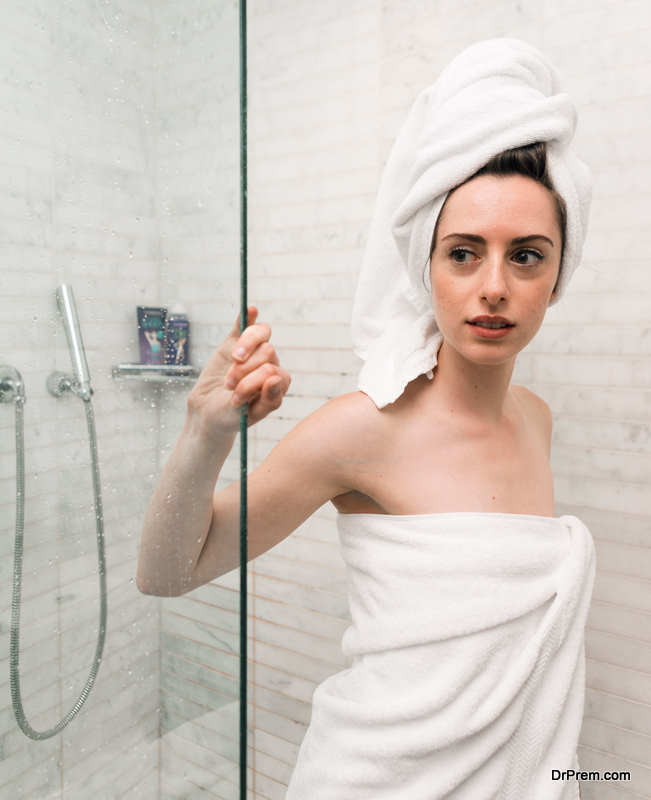 woman standing at Glass Shower Door